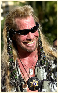 Dog the Bounty Hunter wearing guinea fowl and peacock feathers. Dog rocks!